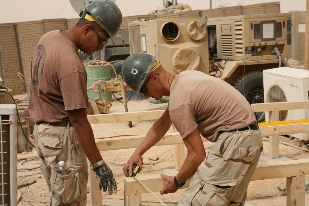 Seabees construct huts in Al Anbar province