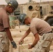 Seabees construct huts in Al Anbar province