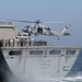 Transferring cargo through vertical replenishment