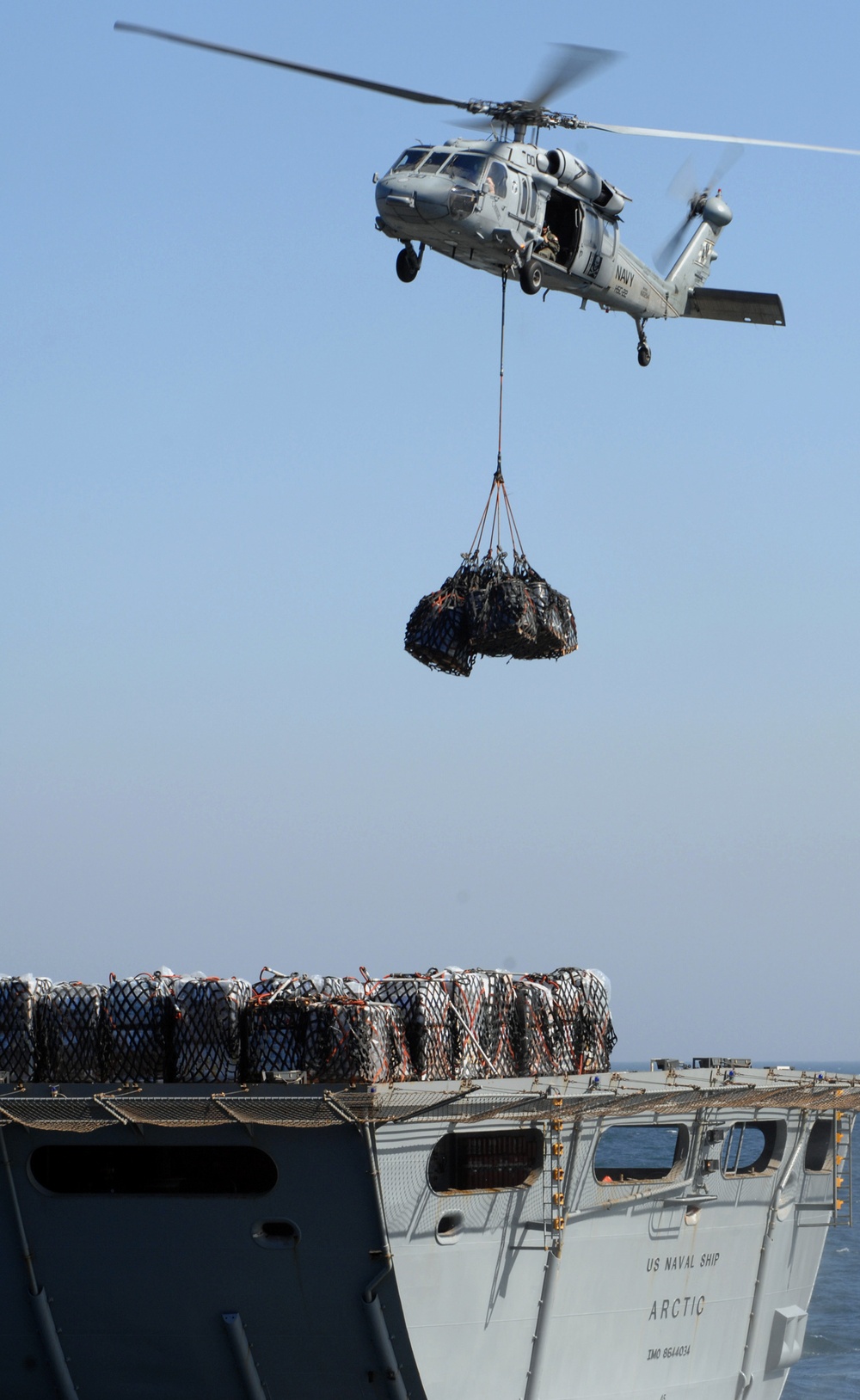 Transferring cargo through vertical replenishment