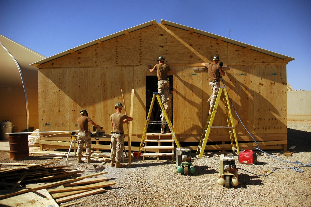 Seabees construct huts in Iraq