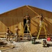 Seabees construct huts in Iraq