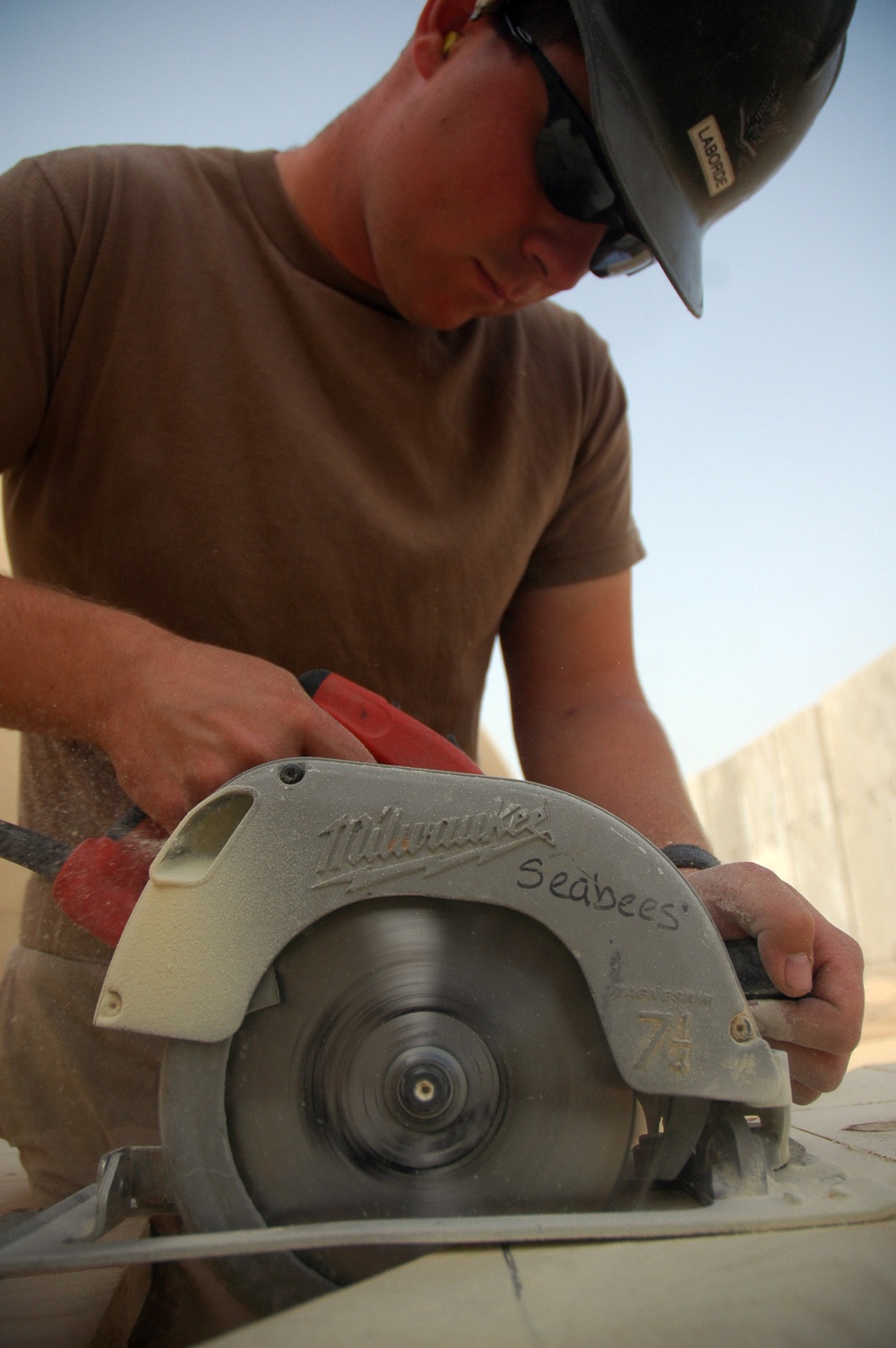 Seabees construct huts in Iraq