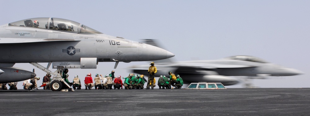 Flight deck personnel prepare for flight operations