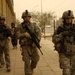 U.S. Iraqi national police, army, patrol streets, look for caches
