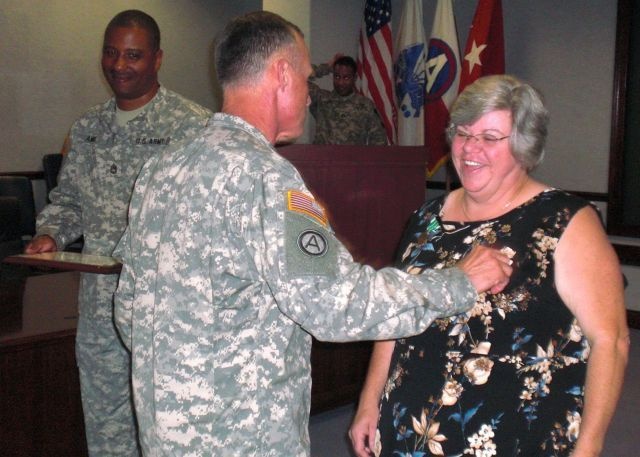 Employee awarded for exceptional service, saving government billions of dollars