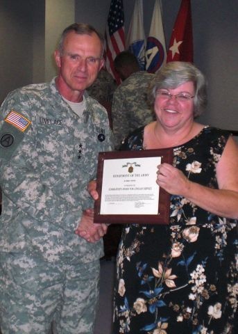 Employee awarded for exceptional service, saving government billions of dollars