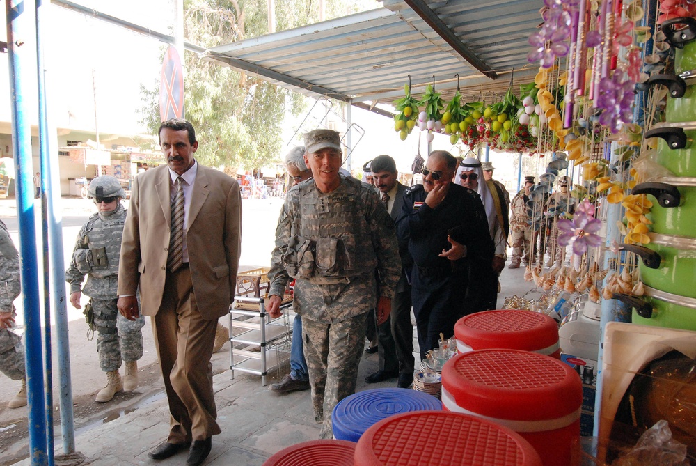 Gen. Petraeus takes a stroll through Hawijah during Army's 233rd Birthday