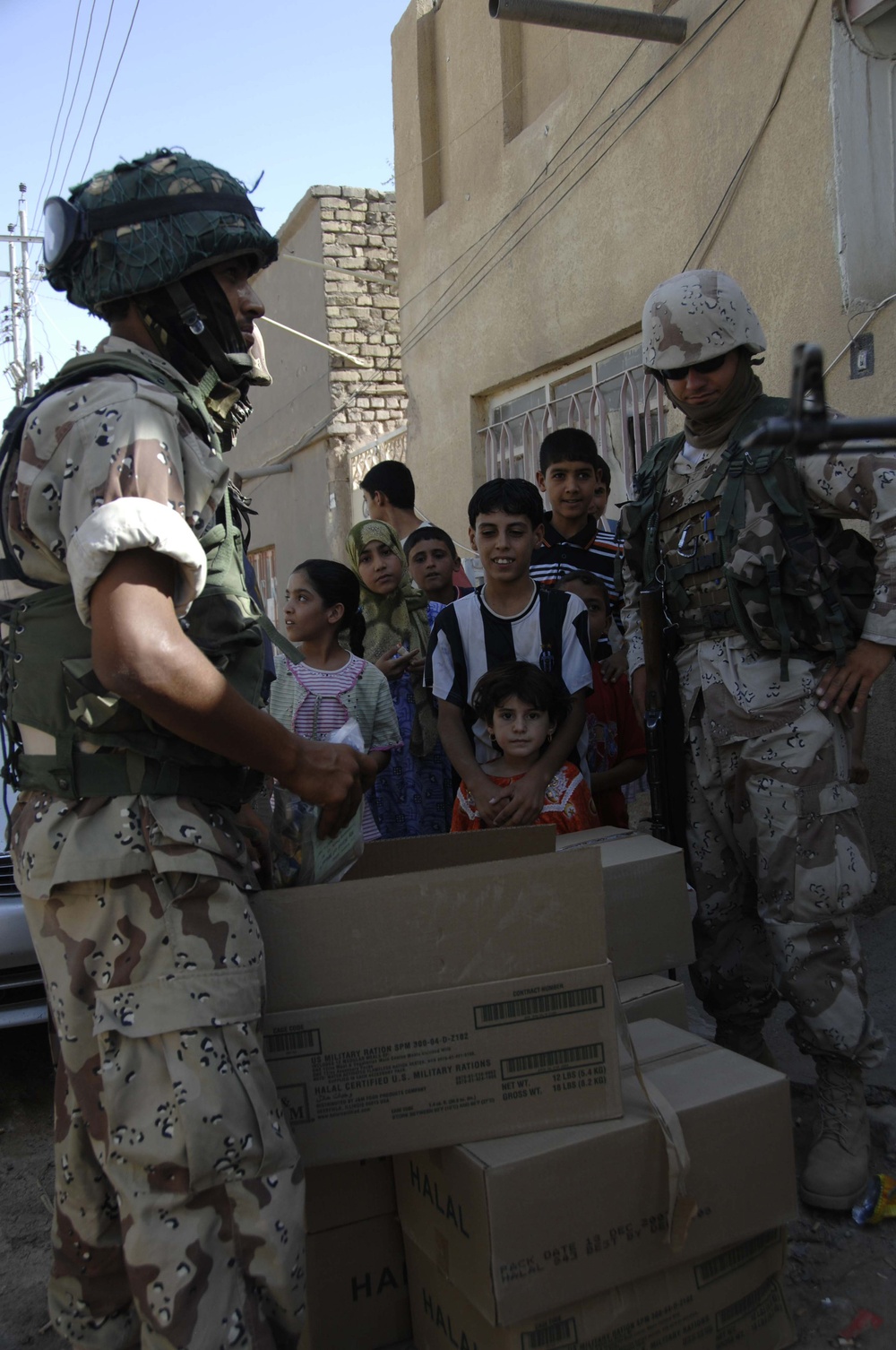 Iraqi Soldiers Hand Out Food in Amarah, Iraq
