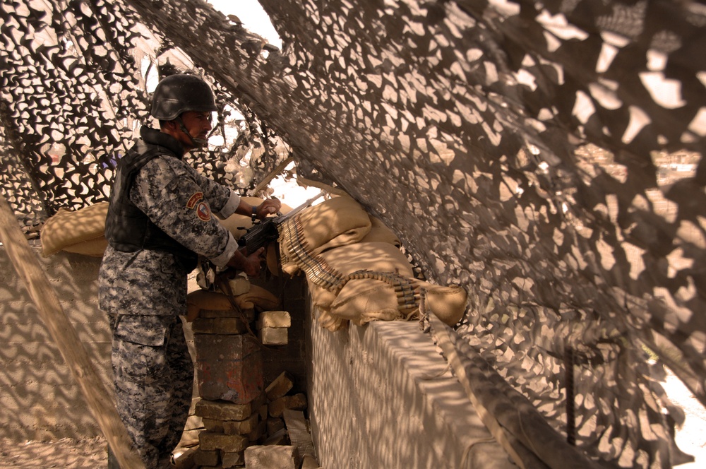 Iraqi Policeman Watches Over the Roadways