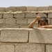 Iraqi Child Waves to U.S. Soldiers on Patrol
