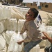 Iraqi Boys Help Move Bottled Water During Women's Engagement