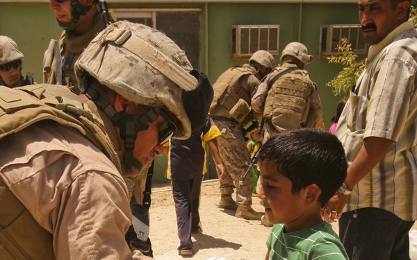 Iraqi Boys Help Move Bottled Water During Women's Engagement