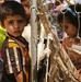 Iraqi Children Wait in Line During Iraqi Women's Engagement