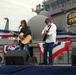 Sailor enjoy Billy Ray Cyrus performance aboard USS Iwo Jima