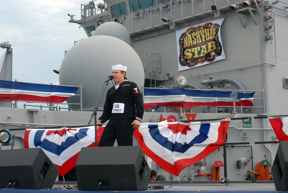 Sailor enjoy Billy Ray Cyrus performance aboard USS Iwo Jima