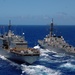 USS Niagara Falls steams along, receives supplies