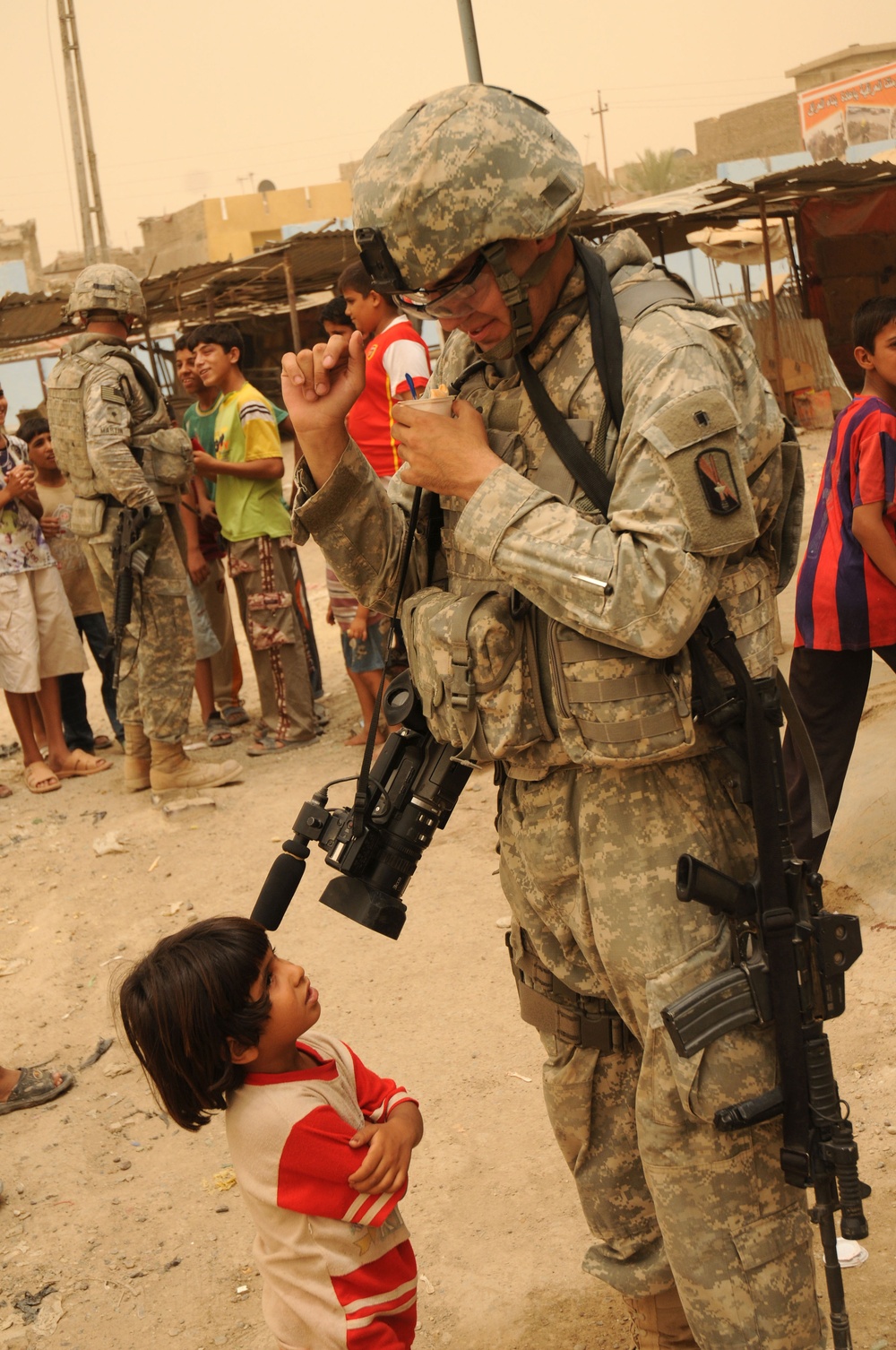 Iraqi Child Watches Combat Cameraman