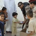 Iraqi Soldiers Hand Out Meals