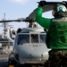 Sailors works on USS Kitty Hawk