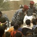 Iraqi police deliver food to Zuwarijat