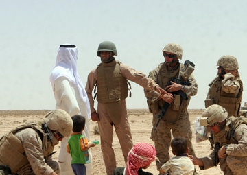 Soldiers assisting Iraqi Children