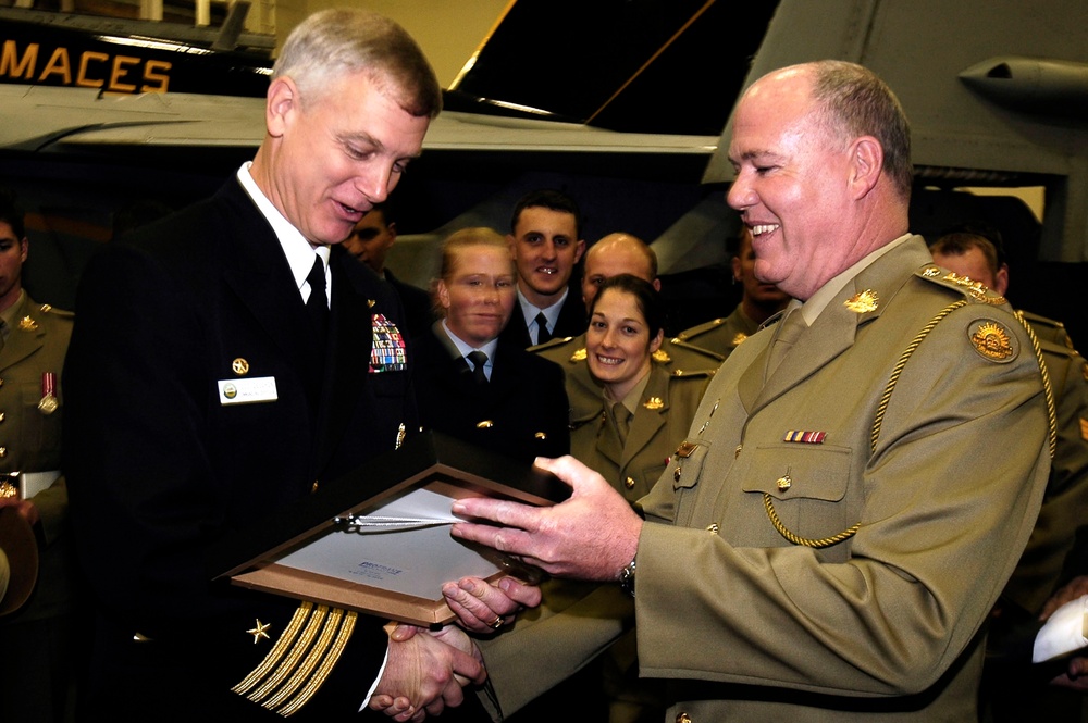 Presentation to commanding officer of USS Kitty Hawk