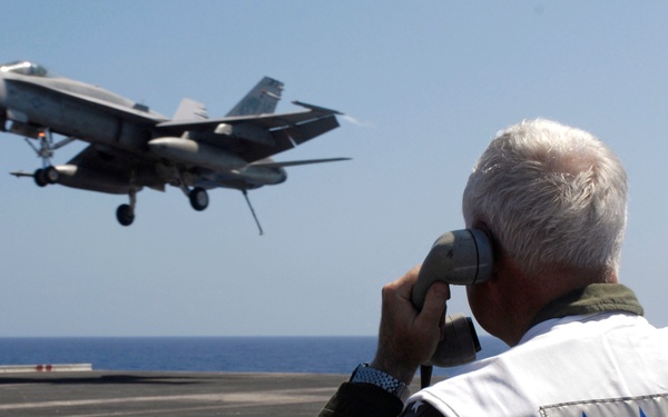 Acting as a landing signal officer