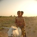 Iraqi Children Pass Roadblock Via Donkey