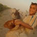 Iraqi Children Pass a Roadblock With Sheep Herd