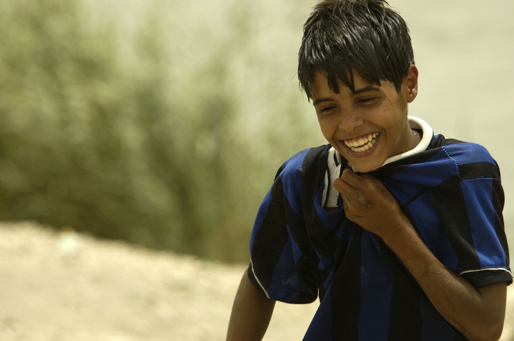 Iraqi Boy Swims in Sadr City River