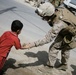 U.S. Marine Slaps Hands With Iraqi Boy