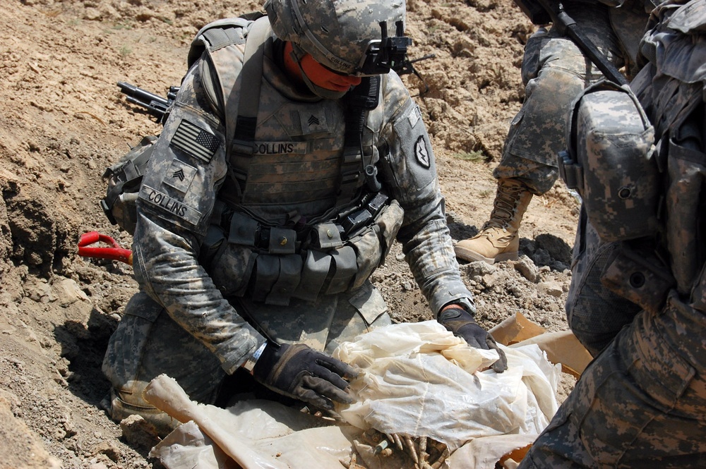 Wolfhounds find and destroy a weapons cache