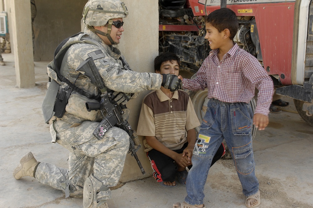 U.S. Soldier Befriends Iraqi Boy