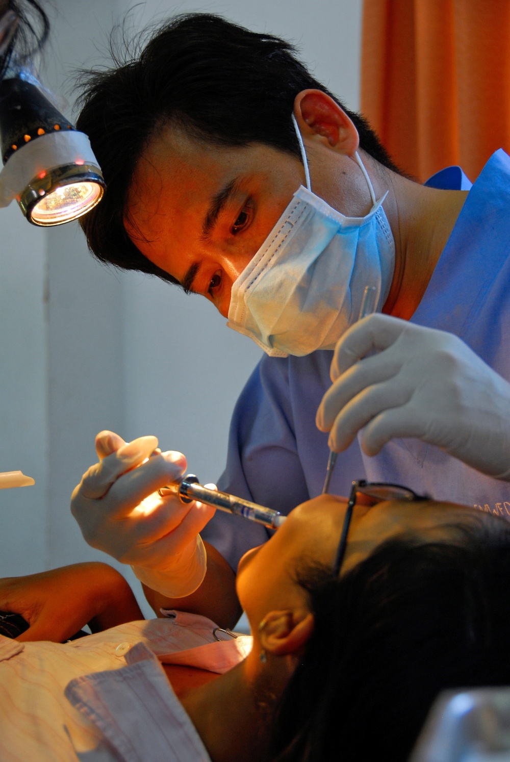 Vietnamese health care professionals work with American counterparts