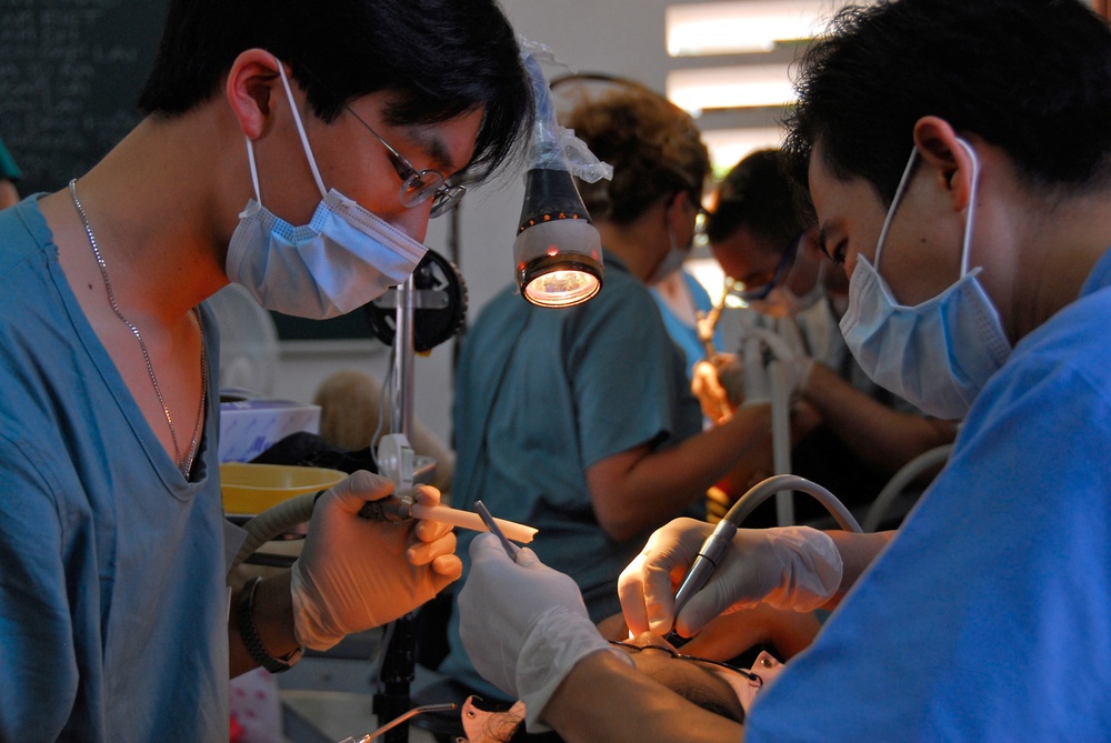 Vietnamese health care professionals work with American counterparts