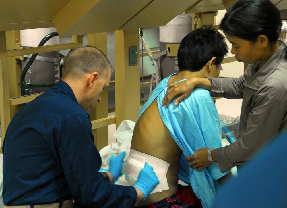 Vietnamese health care professionals work with American counterparts