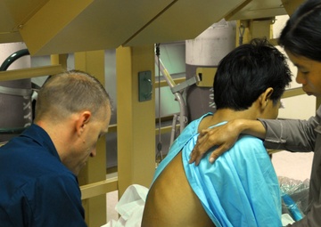 Vietnamese health care professionals work with American counterparts