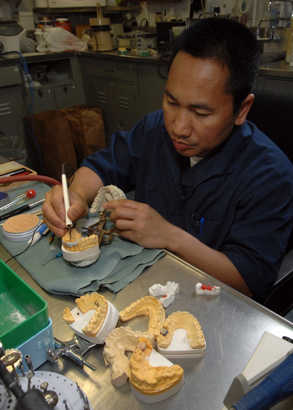 Sailor does dental work aboard USS Harry S. Truman