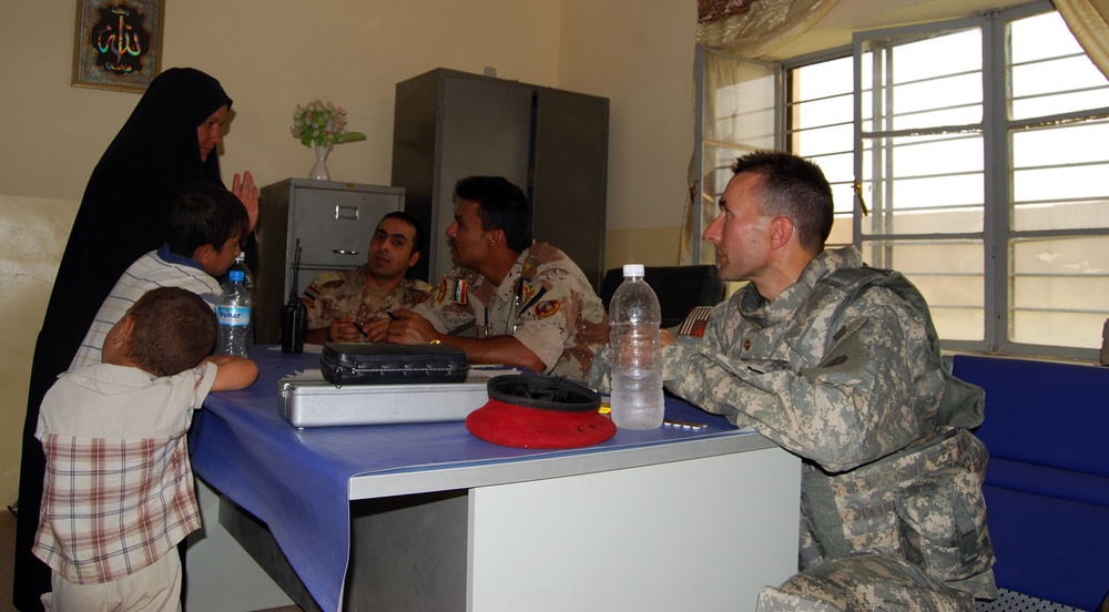 IA, Gimlets Bring Medical Aid to Village in Iraq