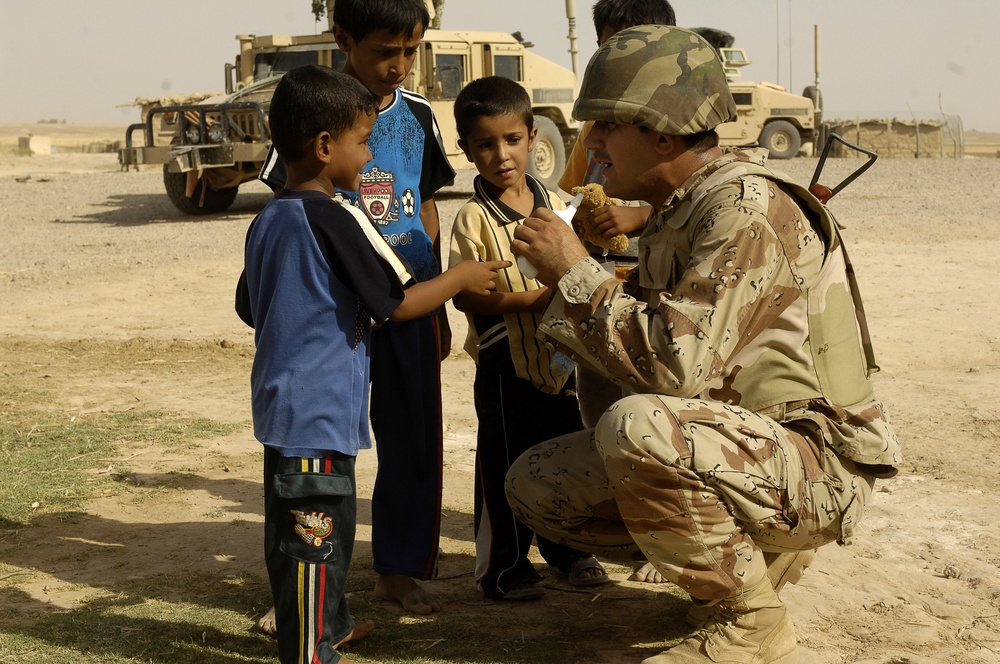 Iraqi Children Receive Toys From Iraqi Soldiers