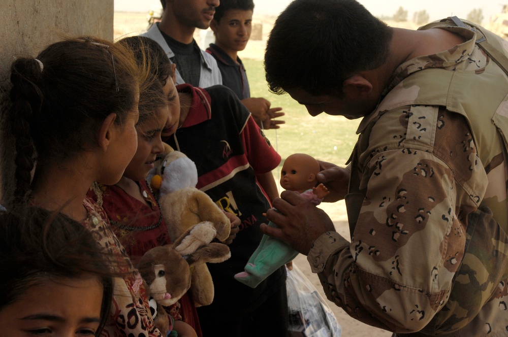 Iraqi Children Receive Toys From Iraqi Soldiers