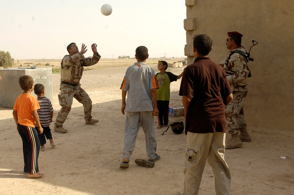 Iraqi Children Receive Toys From Iraqi Soldiers