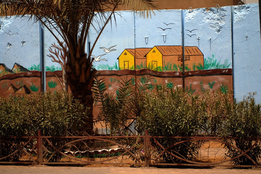 Sadr City walls earn colorful makeover