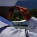 Sailors salute the USS Arizona Memorial