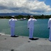 Sailors salute the USS Arizona Memorial