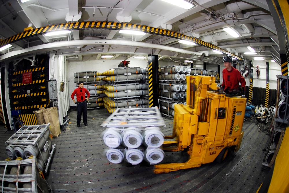 Sailors Transport 500-Pound Bomb Aboard USS Kitty Hawk