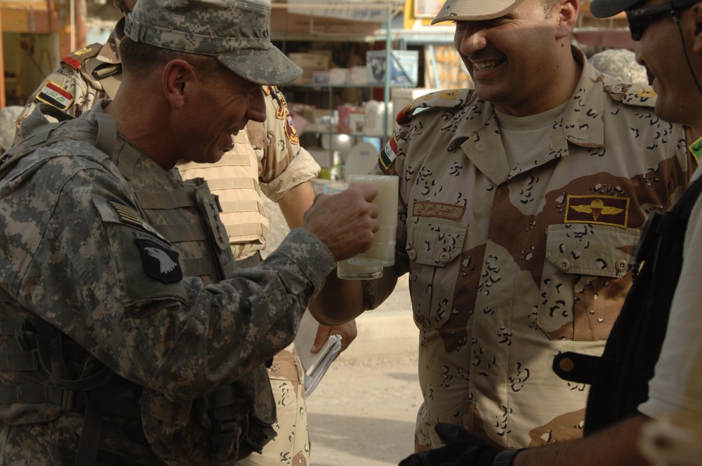 U.S. Army Gen. David Petraeus Tours Market in Abu Ghraib