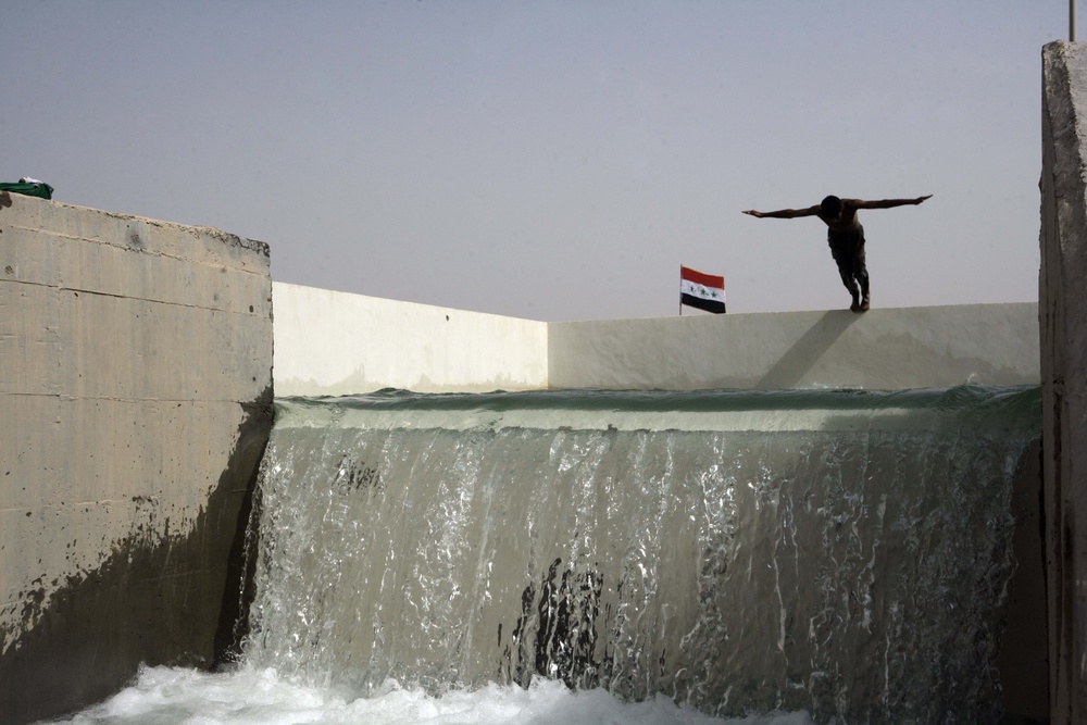 Iraqi Police Take a Swim in New Cistern