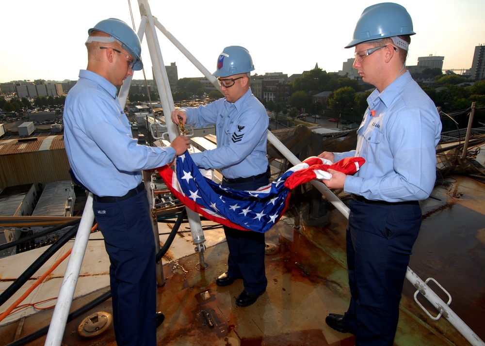 Crewmembers Hoist Flag on PCU George W. Bush